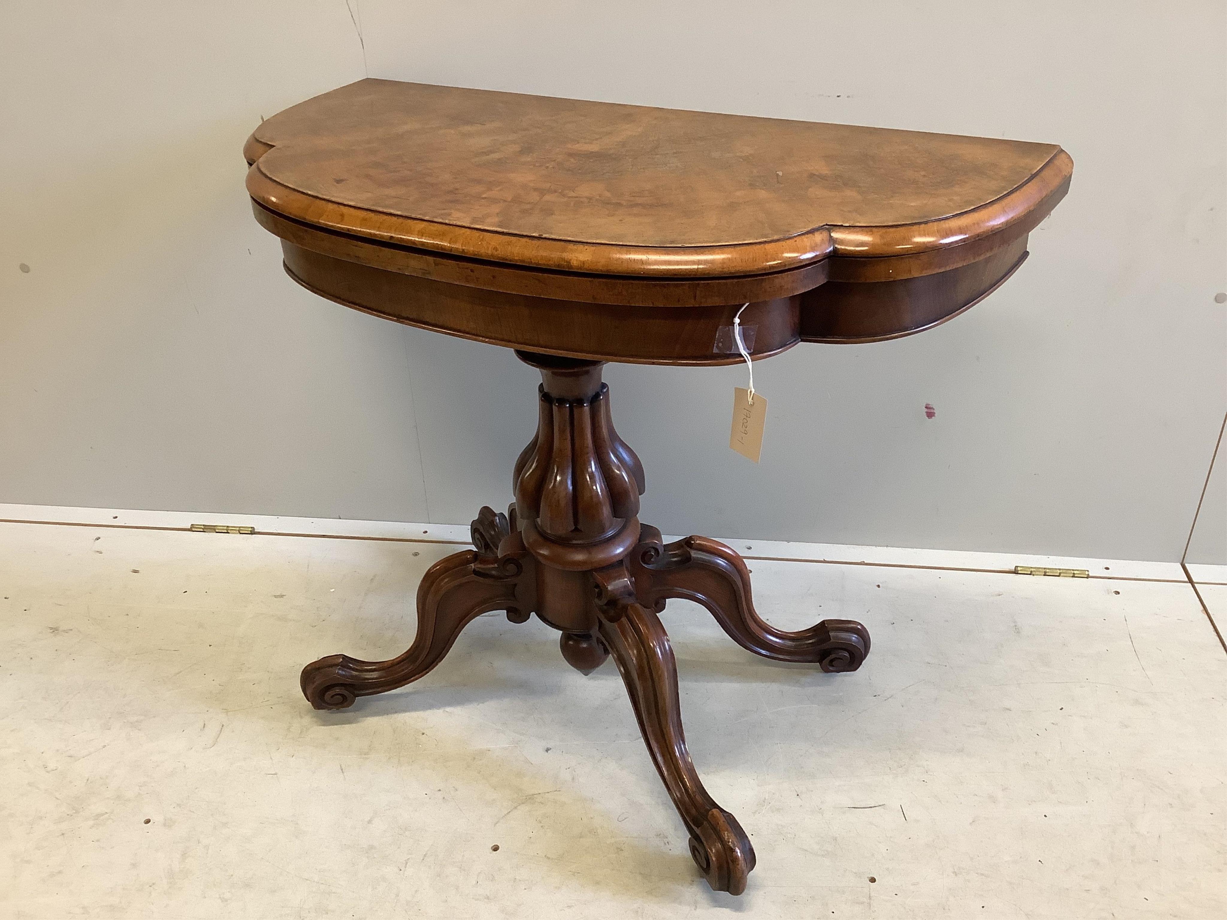 A Victoria figured walnut folding card table, width 91cm, depth 45cm, height 76cm. Condition - fair